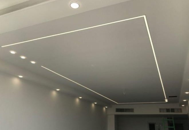 Recessed LED trim outlining a ceiling drop